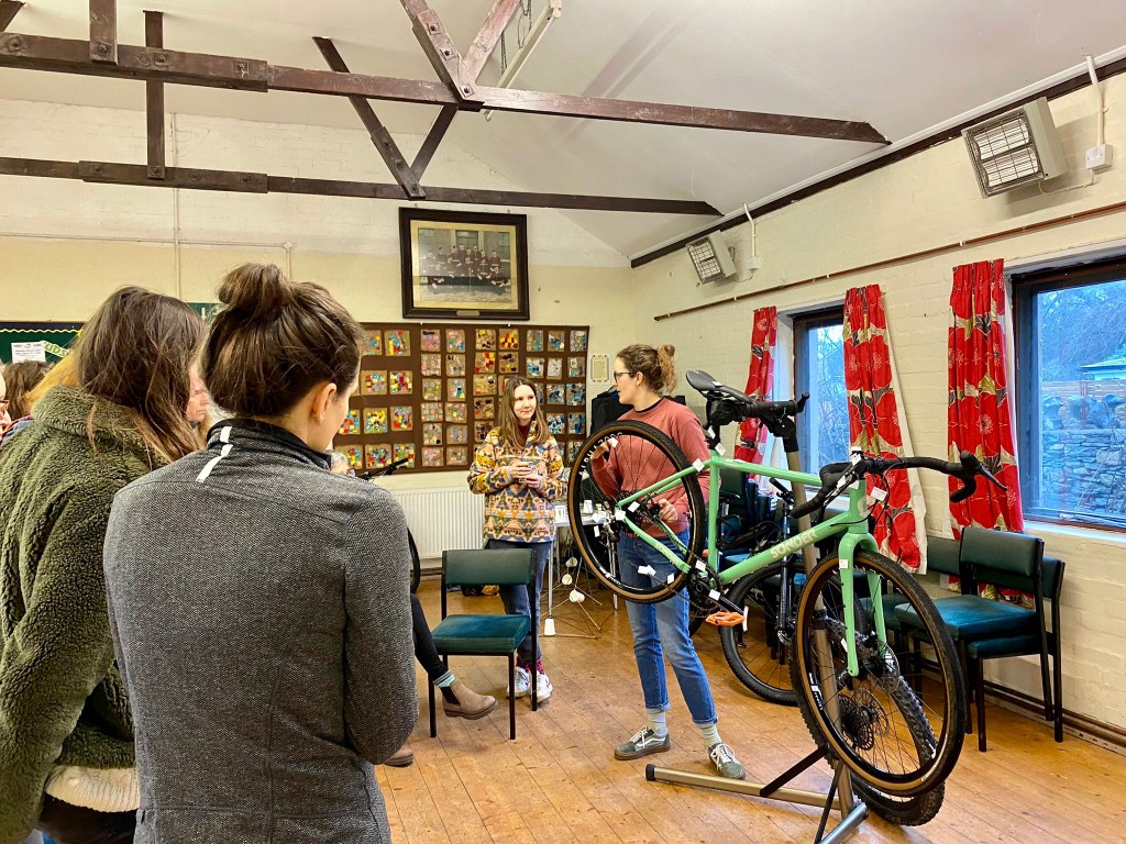 group of women learning bike mechanics